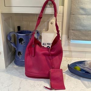 Pink Cole Haan bucket bag with braided handle